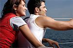 Couple sitting at sailboat border