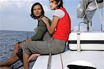 Couple sitting on a sailboat