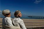 Two mature women chilling at Baltic Sea beach