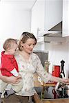 Mother and son cooking