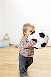 Baby boy holding a football