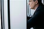 Businessman looking through a window