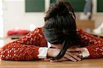 Teenage girl sleeping in a classroom