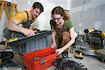 Couple Looking in Toolbox