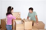 Couple Arguing over Packing Boxes