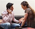 Couple Using Cellular Phone