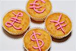 Cupcakes with Monetary Symbols in Icing