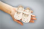 Hands Holding Baby Shoes