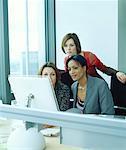 Three Woman Looking at Computer