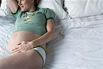 Pregnant Woman on Bed