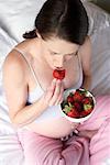 Pregnant Woman Eating Strawberries