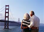 Couple by Golden Gate Bridge, San Francisco, California, USA