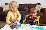 Brother and Sister Playing with Plasticine