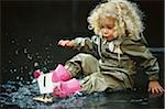 Girl Playing in Puddle