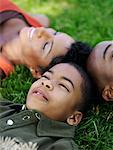 Family Lying Down on Grass