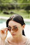Woman Looking Over Sunglasses