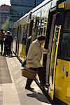 People Boarding Street Car At Alexanderplatz, Berlin, Germany