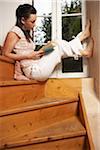 Woman Reading by Window
