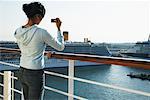 Woman Taking Photos from Cruise Ship