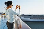 Woman Taking Photos from Cruise Ship