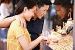 Couple Looking at Jewelry in Shop Window, San Francisco, California, USA