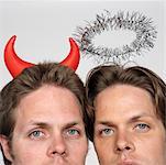Portrait of Twin Brothers Dressed Like Devil and Angel