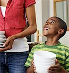 Mother and Son Holding Dishes