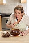 Woman Tasting Cake Icing