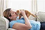 Woman on Sofa with Kitten