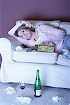 Woman with Red Wine Crying on Sofa