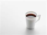 Paper cup of black coffee