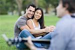 Man Playing Guitar For Couple