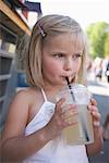 Girl Drinking from Plastic Cup
