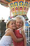 Children Hugging at Amusement Park
