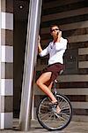 Businesswoman Riding Unicycle