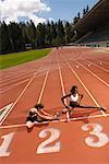 Women Stretching on Track