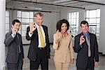 Group Portrait of Business People Making Hand Gesture