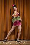 Woman on Stage Holding Flowers