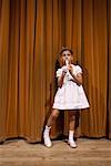 Girl on Stage, Playing Recorder