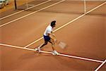High angle view of a mid adult man playing tennis