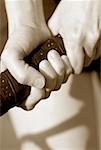 Close-up of a person's hand holding a tennis racket