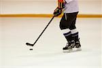 Side profile of an ice hockey player playing ice hockey