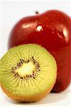 Close-up of half a kiwi and an apple