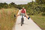 Portrait of a young man performing tricks on a bicycle