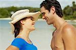 Close-up of a young man and a teenage girl looking at each other