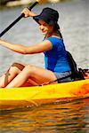 Close-up of a teenage girl kayaking