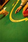 High angle view of person's hand on a gaming table, Las Vegas, Nevada, USA