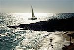 Side view of a sail boat sailing in a vast ocean , St. Martin, Caribbean