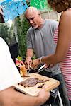 Man Barbequing Meat