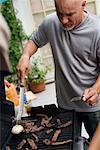 Man Barbequing Meat